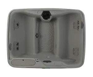 Fantasy Spas Enamor Premier hot tub in Taupe shell color, viewed from above to show seating layout and jet placement.