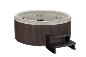 Front view of the Fantasy Spas Splendor Premier hot tub in Sand shell with an Espresso cabinet finish.