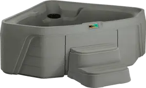 Front view of the Fantasy Spas Embrace hot tub in taupe color with integrated steps.