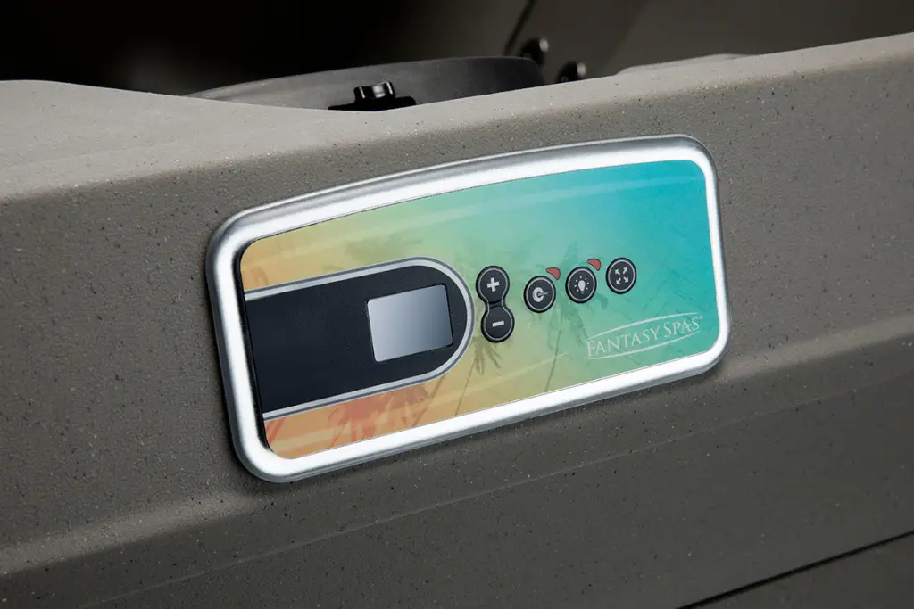 Close-up of Fantasy Spas Enamor control panel with digital buttons and colorful display