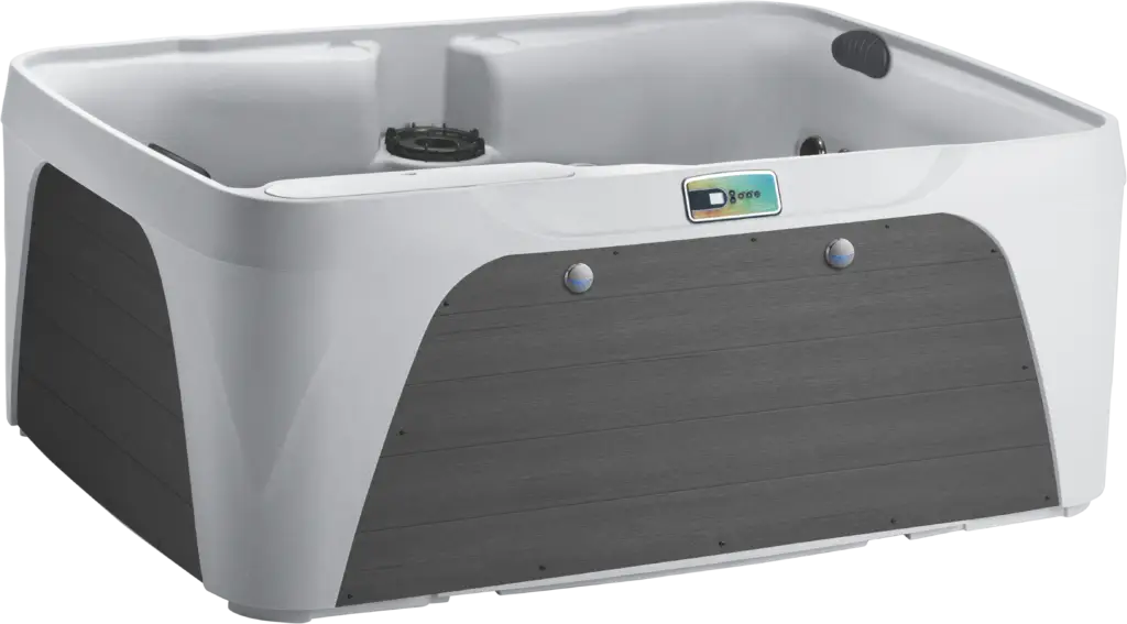 Front view of the Fantasy Spas Enamor Premier in Arctic White shell with Charcoal cabinet, featuring waterfall and stainless steel jet accents.