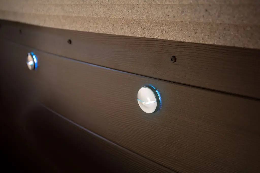 Close-up view of Fantasy Premier Spa exterior LED lights glowing along the cabinet panel