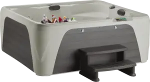 Front view of the Fantasy Spas Entice Premier in Sand shell with Charcoal cabinet.