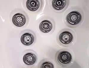 Close-up of hydrotherapy seats with jets demonstrating balanced massage flow.