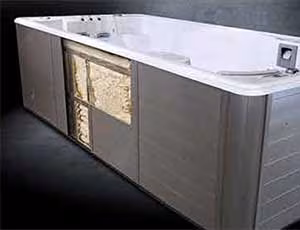 Cross-section diagram showing multi-layer Thermal Shield insulation retaining heat inside a SwimLife Swim Spa.