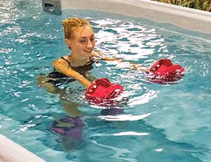Home backyard setup featuring a SwimLife Swim Spa for exercise and relaxation.