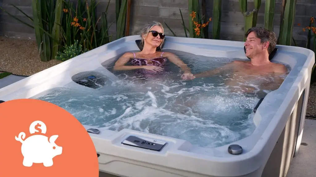Couple relaxing in a hot tub with bubbling water in a backyard setting