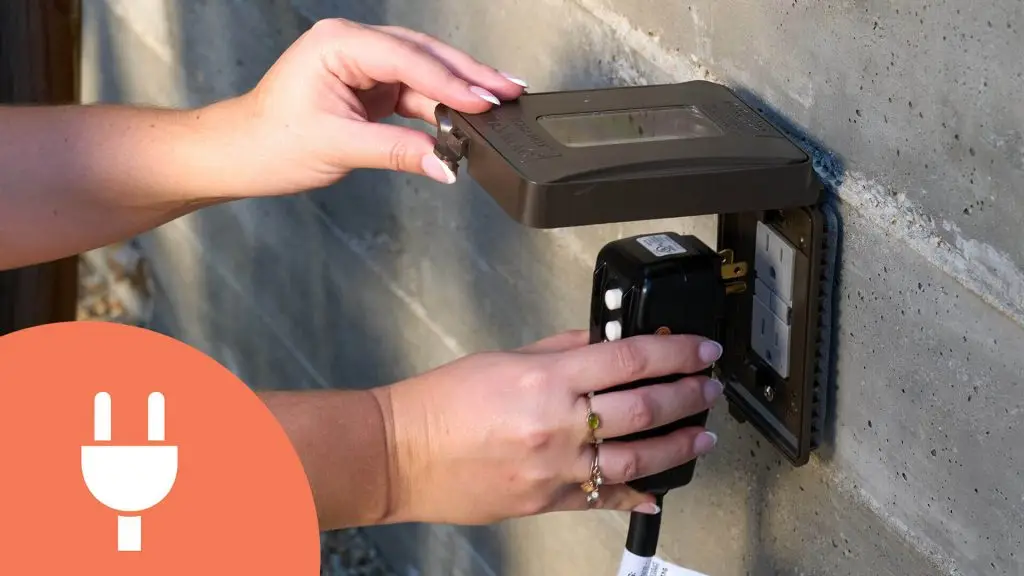 Plugging in hot tub to standard outdoor electrical outlet with weatherproof cover