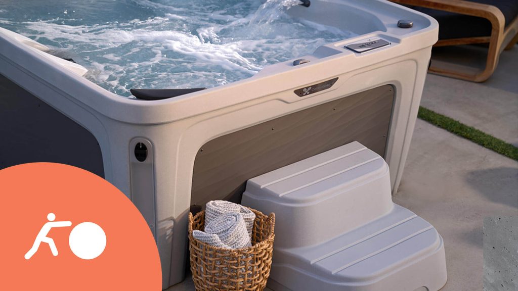 Hot tub with steps in backyard setting highlighting portable spa design