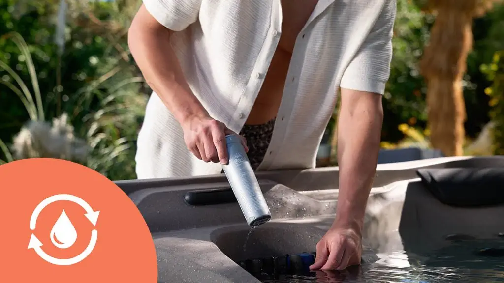 Person placing sanitizer cartridge into hot tub water care system
