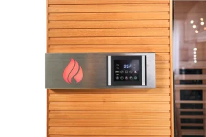 Health Mate Serenity 3 infrared sauna control panel mounted on natural wood exterior with digital temperature display.